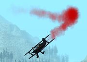 A Stuntplane with its red smoke ejector turned on.