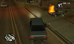 Sweet firing his pistol at a Seville car chasing them.