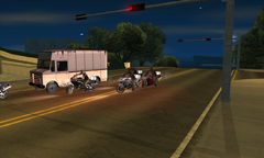 The couriers stealing the packages out of a Boxville.
