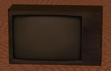 A brown television without buttons or knobs.