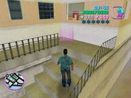 Tommy Vercetti outside the apartment of the Sharks Thief.