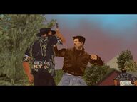 Claude punching a Colombian Cartel gangster.