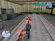 Tommy Vercetti attacking guards inside the hangar.