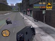 Claude and the bank robbers attempting to lose the police whilst a car gives chase.