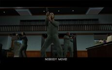 Tommy Vercetti, Phil Cassidy, and Cam Jones holding up El Banco Corrupto Grande.