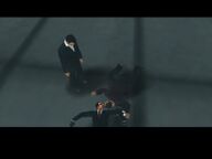Toni Cipriani standing over the corpses of Vincenzo Cilli and an un-named Leone Family mobster.