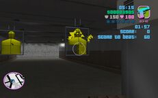 Tommy Vercetti about to shoot one of the suspended dummies.