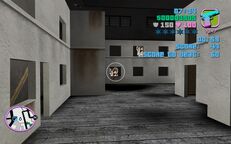 Tommy Vercetti about to shoot the cardboard target.