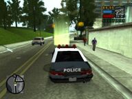 Toni Cipriani, in the police car, about to escort Salvatore Leone to the court house.