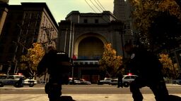 LCPD and NOOSE officers surround the building.