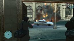 Niko shooting a police car.