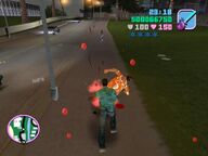 Tommy Vercetti attacking Gonzalez with a chainsaw.