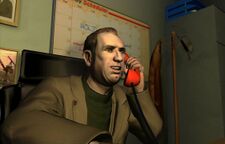 Niko Bellic hanging on the back of The Truck.