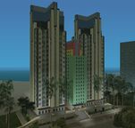 A beachfront hotel in GTA Vice City. Composing of two towers with cross-shaped crowns sandwiching a single pastel building which borrows its crown design from 1102 Washington Street.