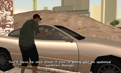 Zero hands Carl Johnson the tracker and explains to him how it works.
